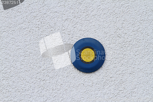 Image of button on grunge wall