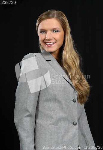 Image of Young beautiful smiling business woman
