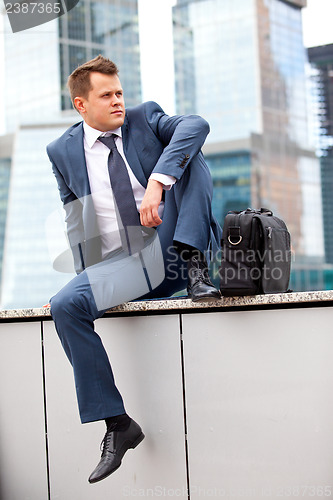 Image of Businessman near office towers