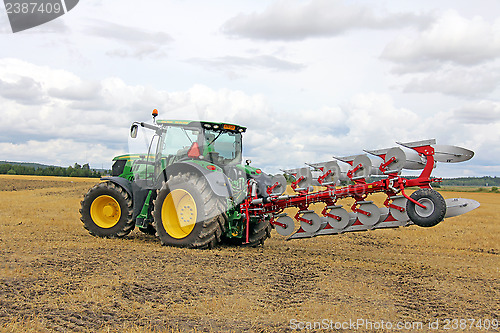 Image of John Deere Tractor and Agrolux Plow