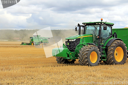 Image of John Deere 7280R Agricultural Tractor and T560 Combine Harvester