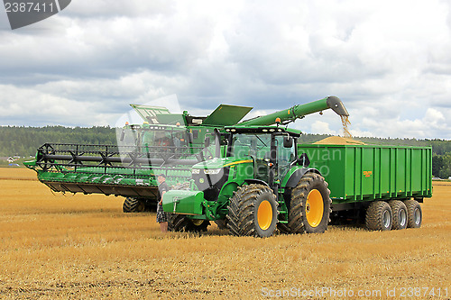 Image of John Deere Combine Unloading Grain
