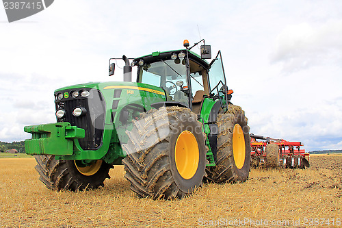 Image of John Deere 8430 Agricultural Tractorand Cultivator