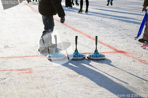 Image of eisstock curling toys tool people play winter game 