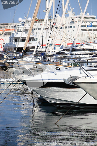 Image of Luxury yachts with a cruise liner behind