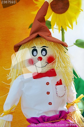 Image of Colorful scarecrow at garden of paper