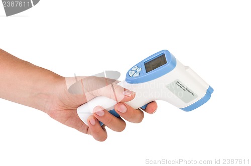 Image of Hand hold a non-contact IR thermometer