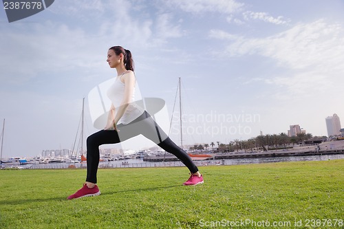 Image of Young beautiful  woman jogging  on morning