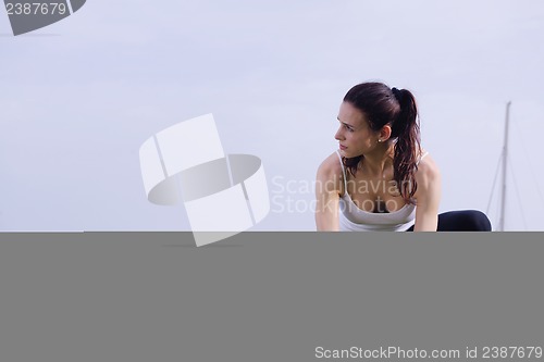 Image of Young beautiful  woman jogging  on morning