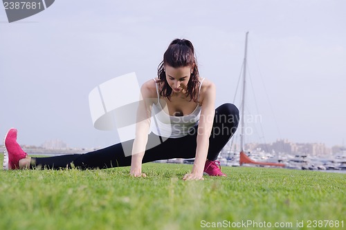 Image of Young beautiful  woman jogging  on morning