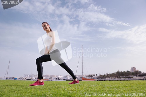 Image of Young beautiful  woman jogging  on morning