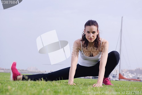 Image of Young beautiful  woman jogging  on morning