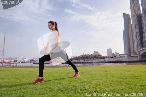 Image of Young beautiful  woman jogging  on morning