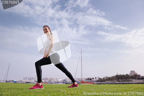 Image of Young beautiful  woman jogging  on morning