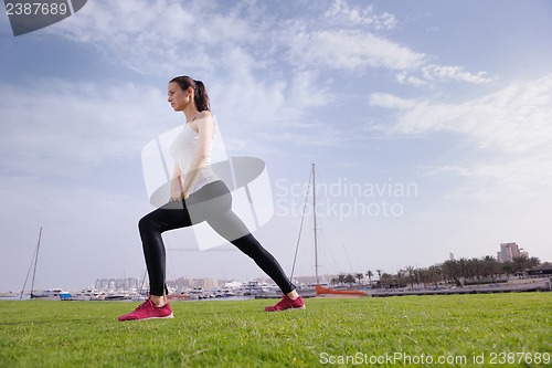 Image of Young beautiful  woman jogging  on morning