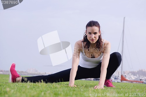 Image of Young beautiful  woman jogging  on morning