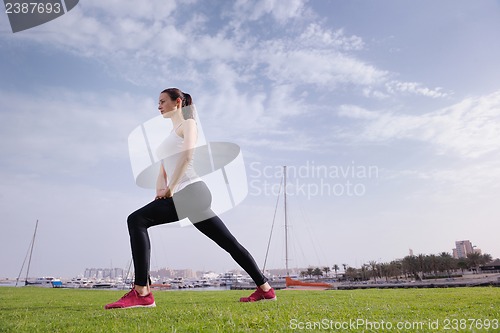 Image of Young beautiful  woman jogging  on morning