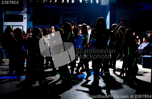 Image of Silhouettes of dancing teenagers