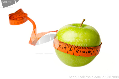 Image of Green apple and measuring tape