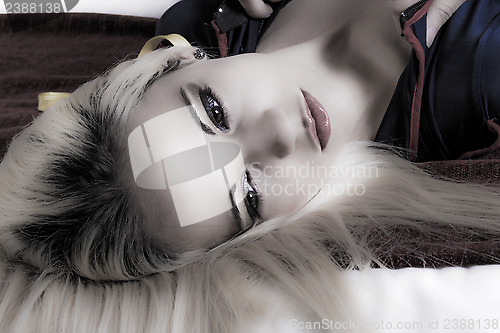 Image of moody portrait of blonde woman