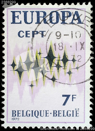 Image of Stamp printed in Belgium showing sparkling stars on a white background