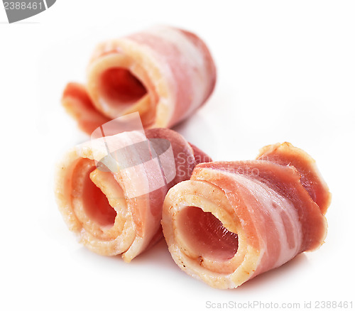 Image of bacon rolls on white background