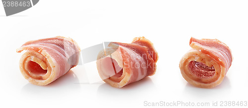 Image of bacon rolls on white background