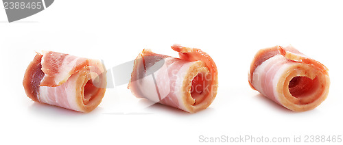 Image of bacon rolls on white background