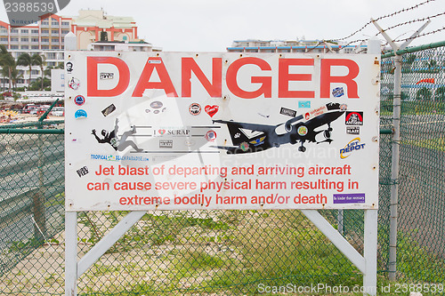 Image of PRINCESS JULIANA AIRPORT, ST MARTIN - JULY 19, 2013: Warning sig