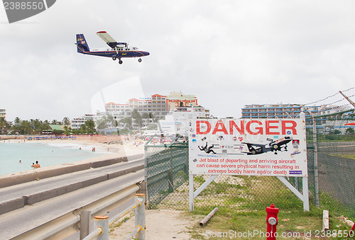 Image of PRINCESS JULIANA AIRPORT, ST MARTIN - JULY 19, 2013: Warning sig