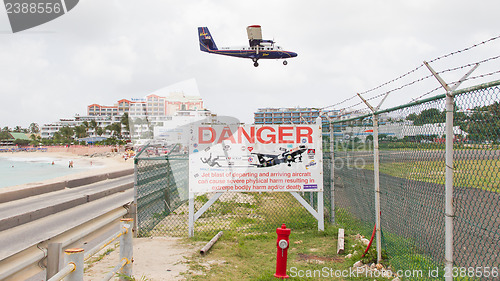 Image of PRINCESS JULIANA AIRPORT, ST MARTIN - JULY 19, 2013: Warning sig