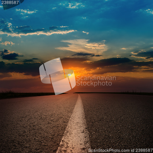 Image of asphalt road to sunset