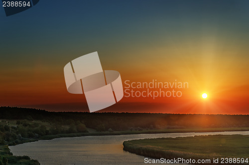 Image of red sunset over river