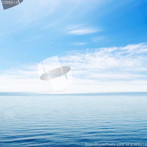 Image of blue sea and cloudy sky over it
