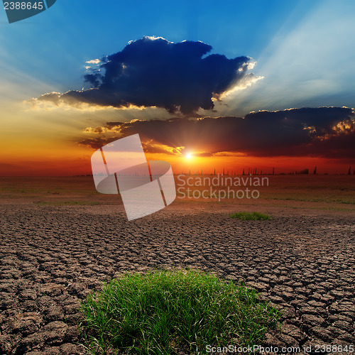 Image of dramatic sunset over barren earth