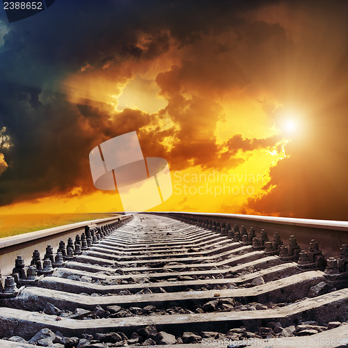 Image of dramatic sunset over railroad