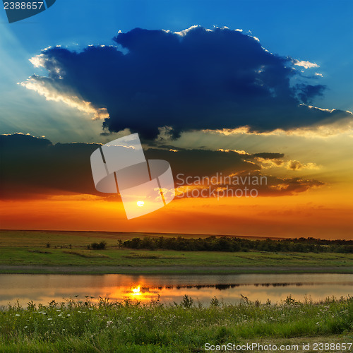 Image of dramatic sunset over river