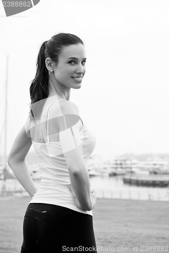 Image of Young beautiful  woman jogging  on morning