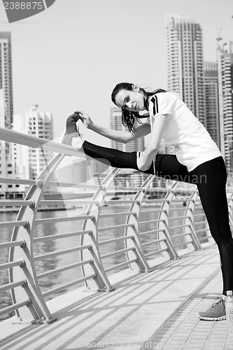 Image of Young beautiful  woman jogging  on morning