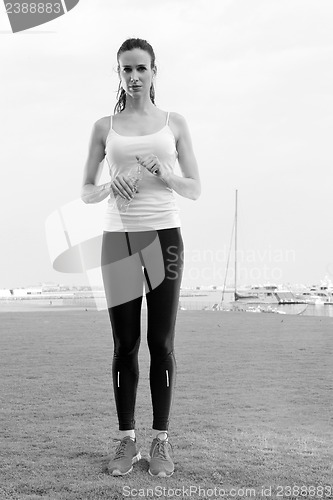 Image of Young beautiful  woman jogging  on morning