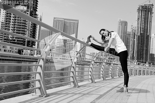 Image of Young beautiful  woman jogging  on morning