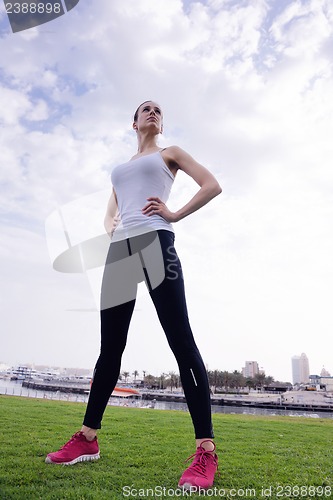 Image of Young beautiful  woman jogging  on morning