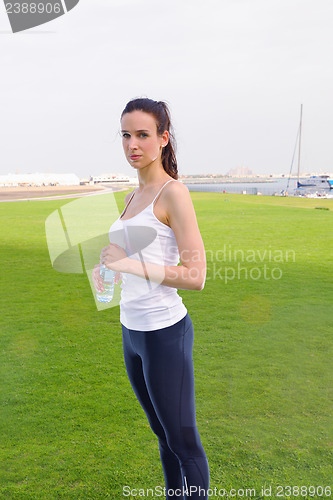 Image of Young beautiful  woman jogging  on morning