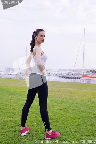 Image of Young beautiful  woman jogging  on morning