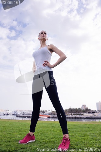 Image of Young beautiful  woman jogging  on morning