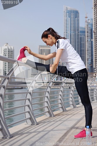 Image of Young beautiful  woman jogging  on morning