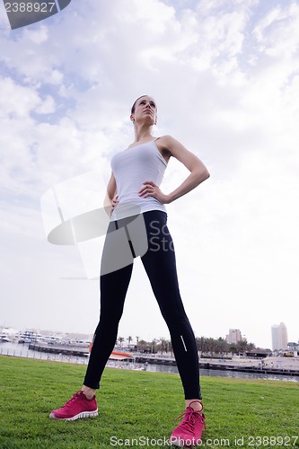 Image of Young beautiful  woman jogging  on morning