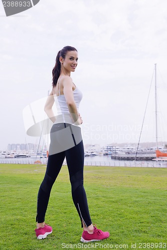 Image of Young beautiful  woman jogging  on morning