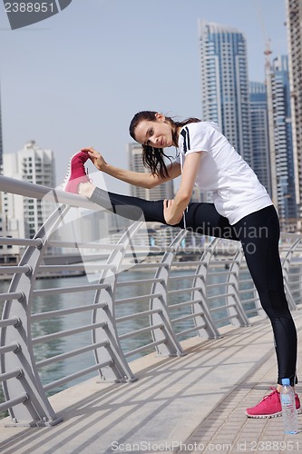 Image of Young beautiful  woman jogging  on morning