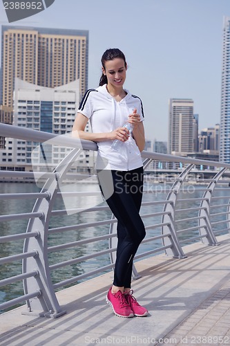 Image of Young beautiful  woman jogging  on morning